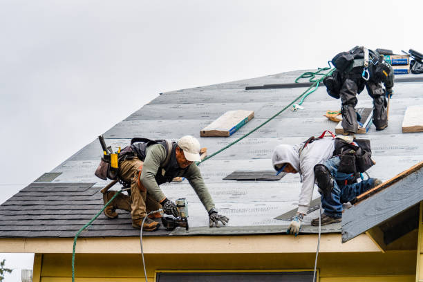 Professional Roofing technician working in Williston Park, NY